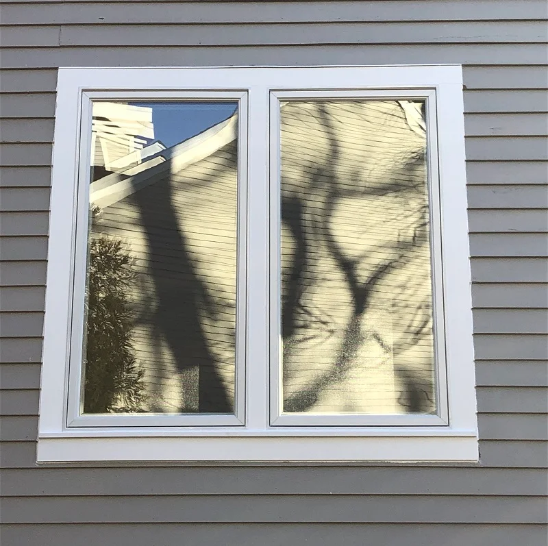 Andersen 400 Series double casement window with PVC exterior trim in Scarsdale, NY